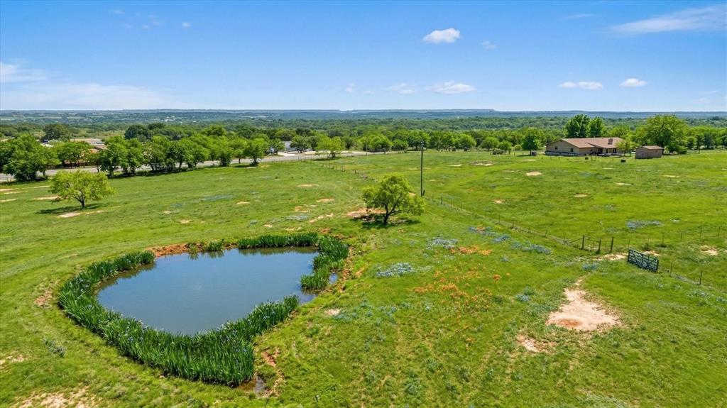 17305 Highway 281 Hico, TX 76457 - Photo 25 of 28 a view of a lake with a yard