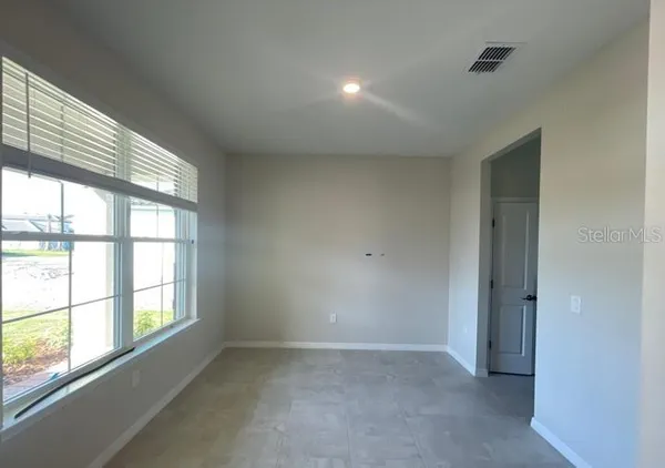 an empty room with windows