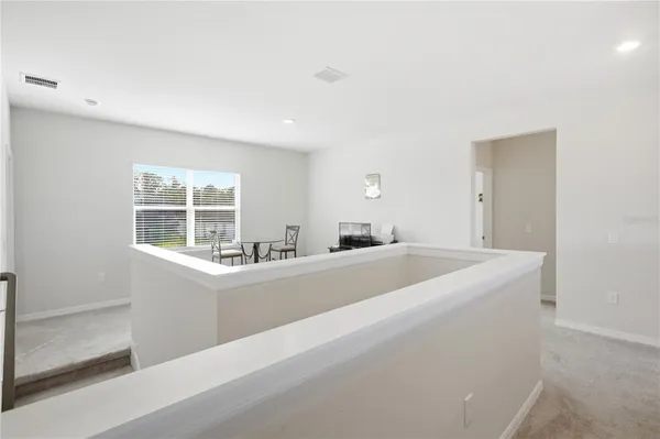 a view of living room with furniture and windows