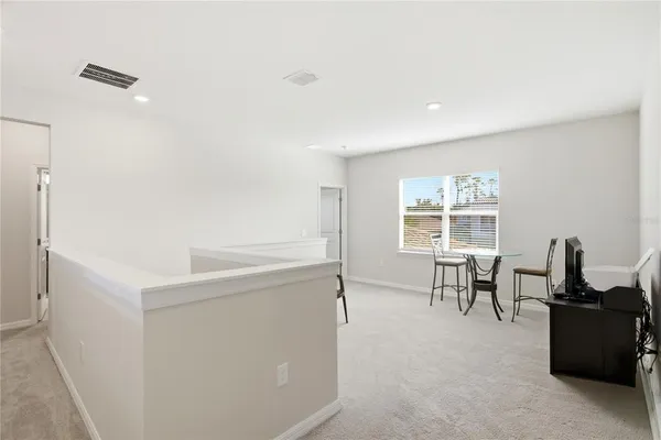 a view of a livingroom with furniture and windows