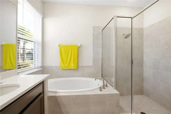 a bathroom with a bathtub and a sink