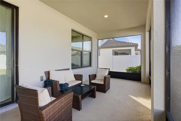 a view of a dining room with furniture window and outside view