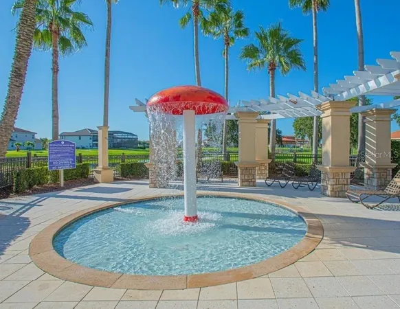 a view of a porch with furniture and a yard