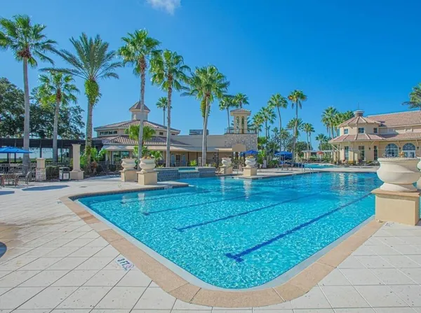 a view of yard with swimming pool and seating area