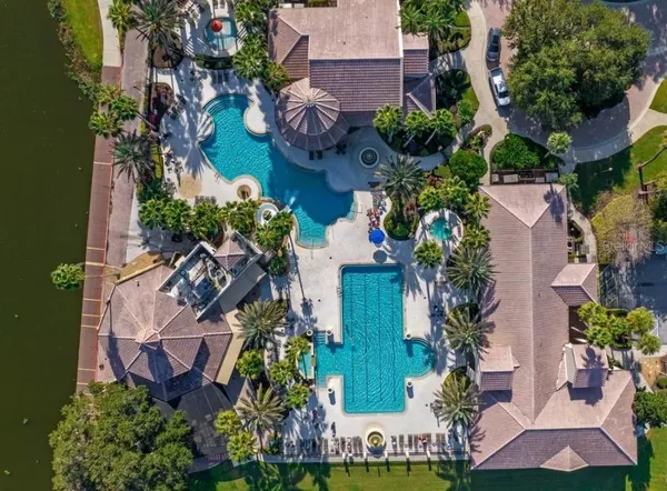 an aerial view of a house with a lake view