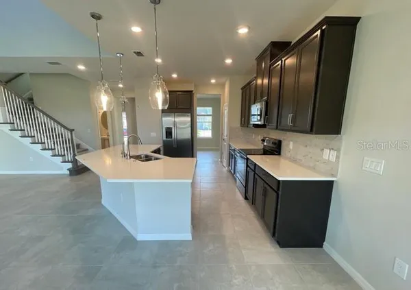 a large spacious bathroom with a large tub and sink