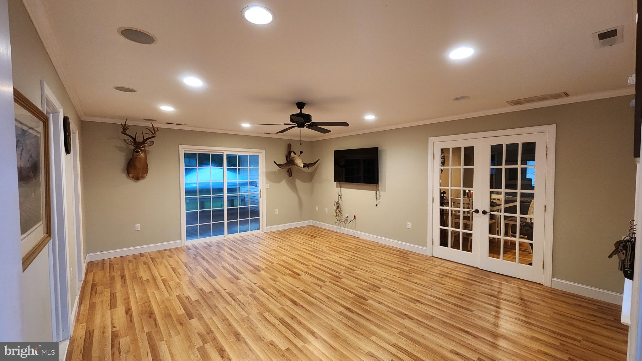 5020 Bucktown Road Cambridge, MD 21613 - Photo 11 of 20 a view of an empty room with wooden floor and a window