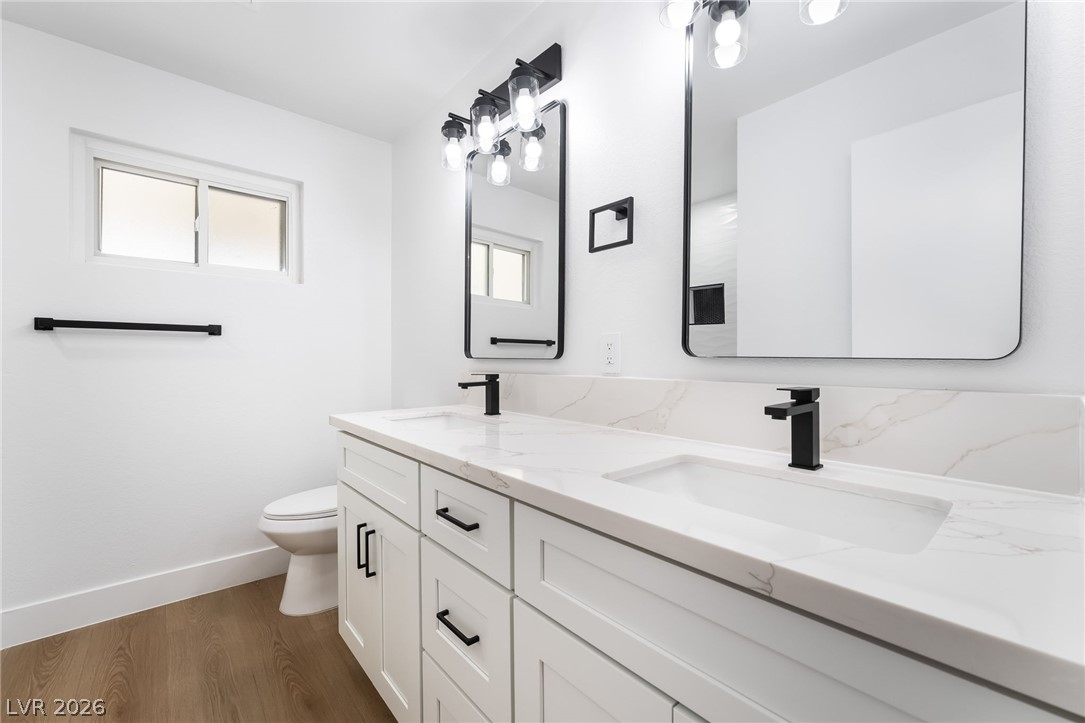 429 Crestway Road Henderson, NV 89015 - Photo 39 of 56 A well-appointed bath features a double vanity and contemporary fixtures, creating a serene space for personal care.
