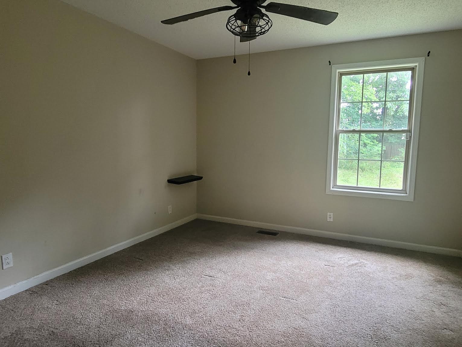 744 Needmore Road Clarksville, TN 37040 - Photo 5 of 12 an empty room with a window