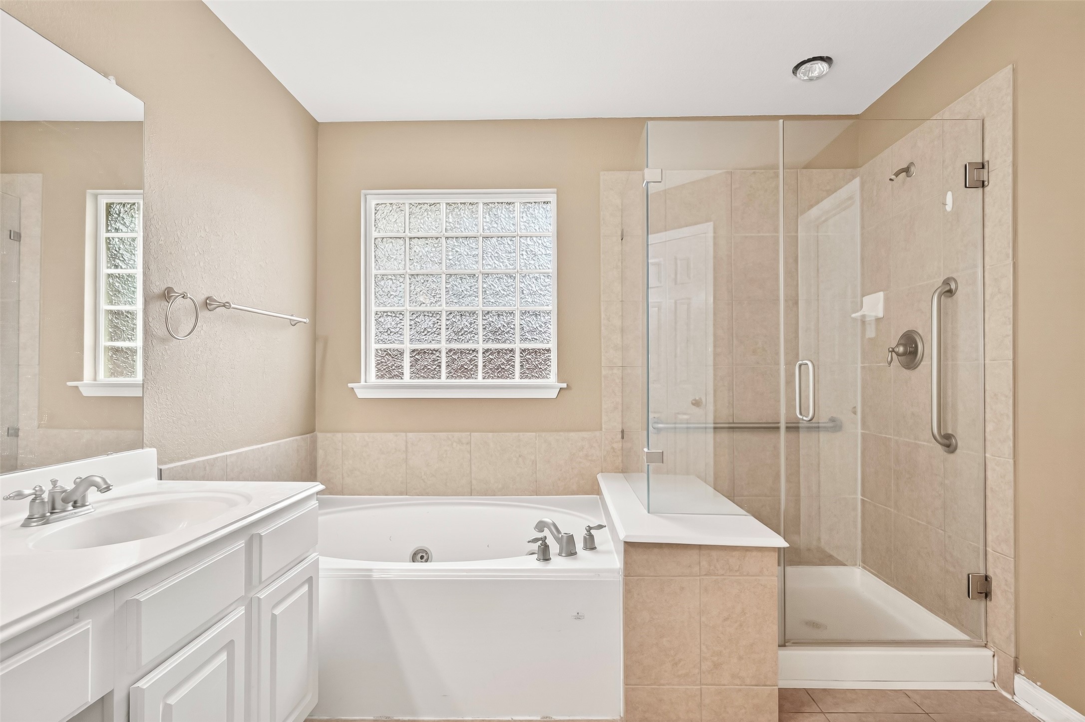 21018 Ripford Court Richmond, TX 77406 - Photo 30 of 48 The primary bath features a separate shower and soaking tub