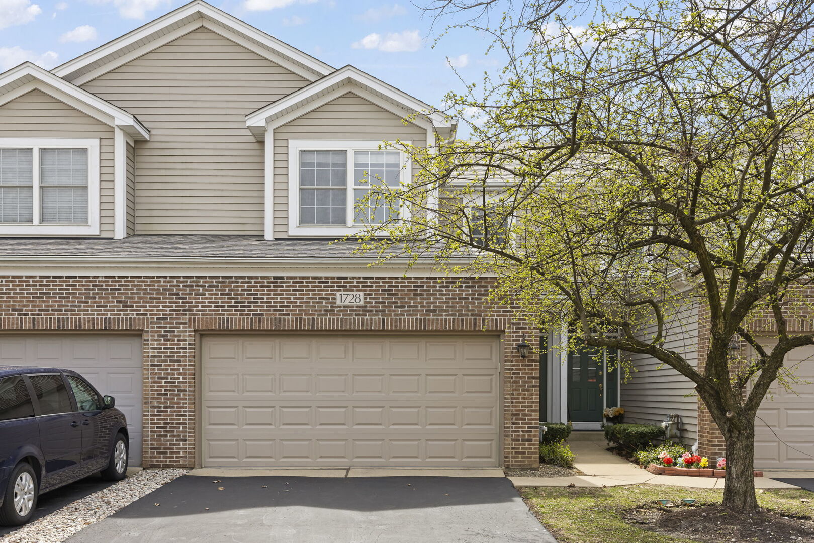 a front view of a house with a yard
