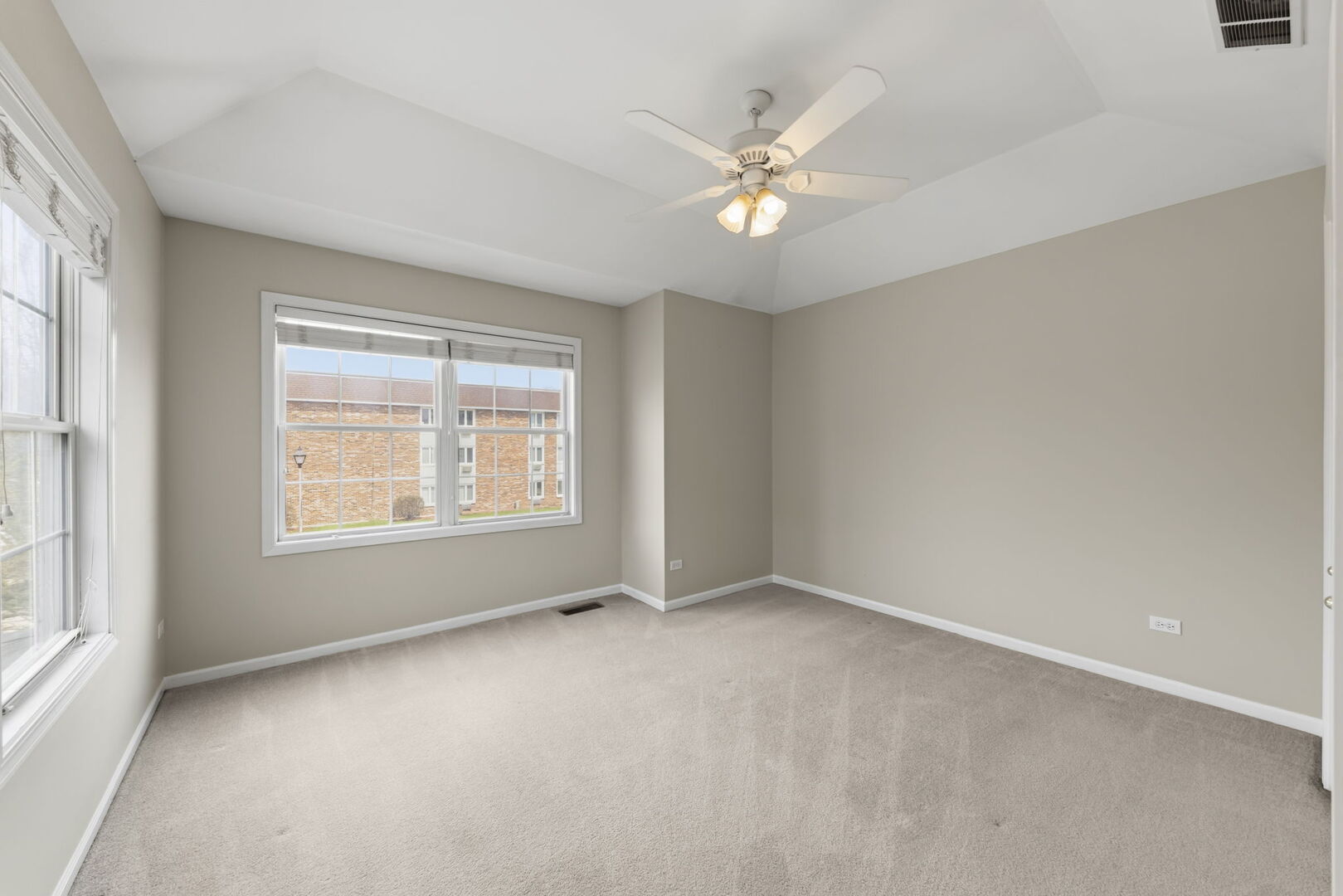 1728 Pershing Avenue, Unit 3 Wheaton, IL 60189 - Photo 19 of 32 a view of an empty room with a window