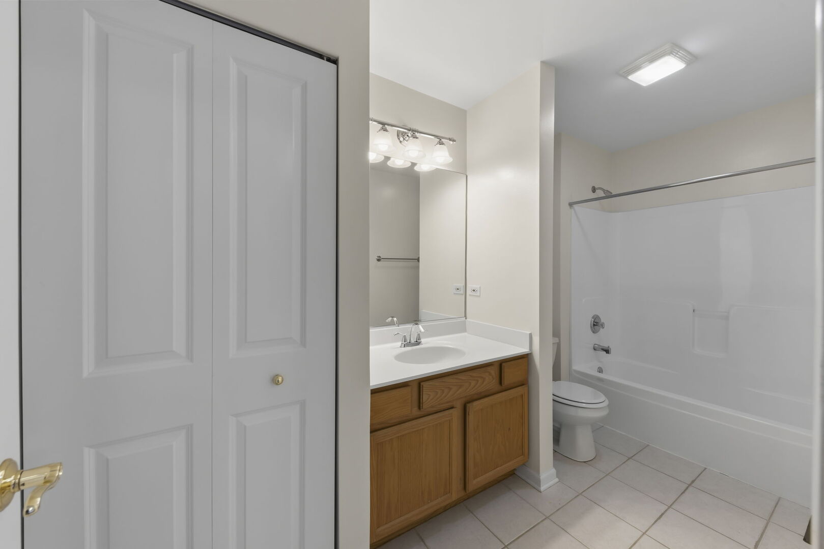 1728 Pershing Avenue, Unit 3 Wheaton, IL 60189 - Photo 20 of 32 a bathroom with a granite countertop sink toilet and shower