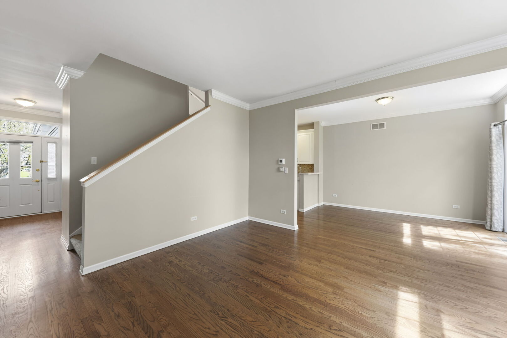 1728 Pershing Avenue, Unit 3 Wheaton, IL 60189 - Photo 5 of 32 a view of an empty room with wooden floor