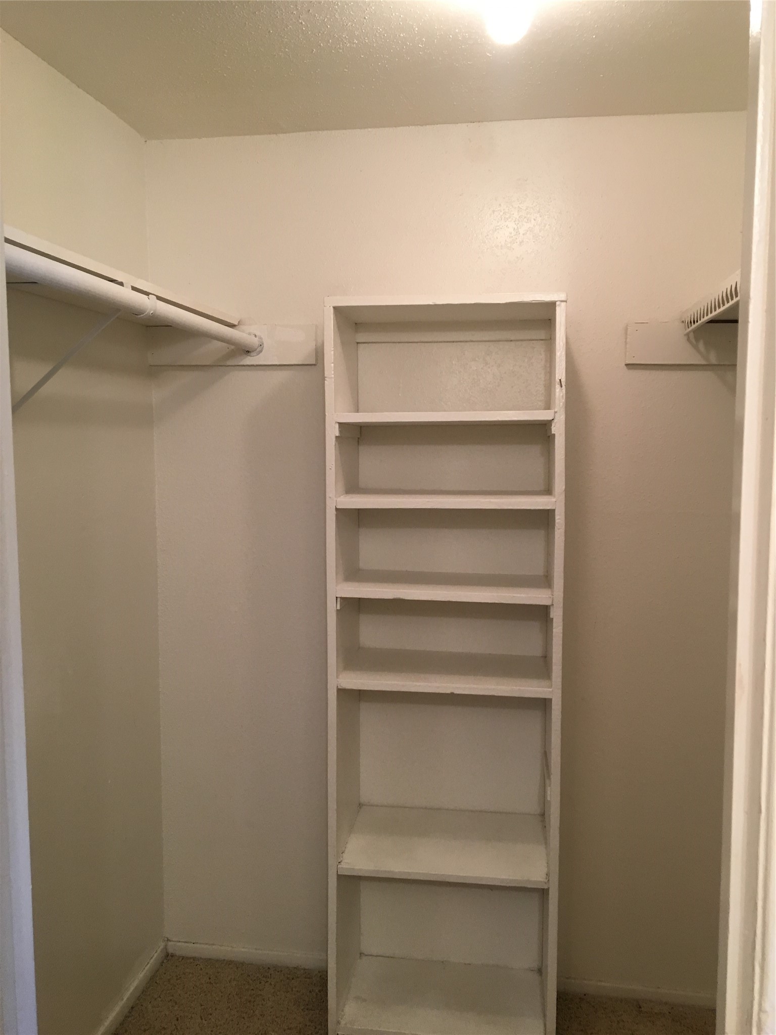 6200 West Tidwell Road, Unit 602 Houston, TX 77092 - Photo 9 of 9 a view of walk in closet with empty racks