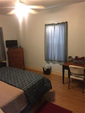 a bedroom with a bed and cabinets