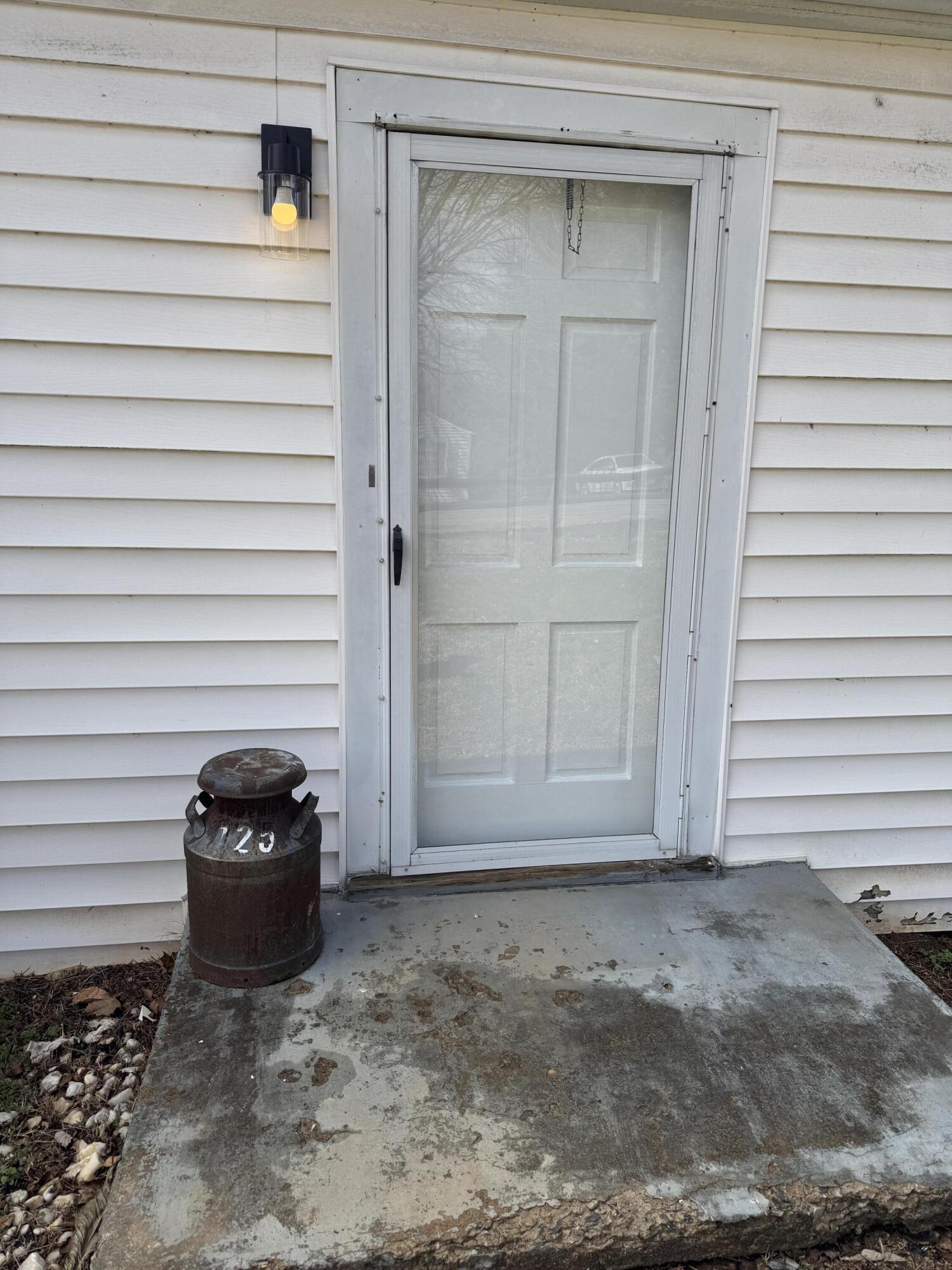 125 Elam Drive Ridgeway, VA 24148 - Photo 2 of 10 a view of a car garage door