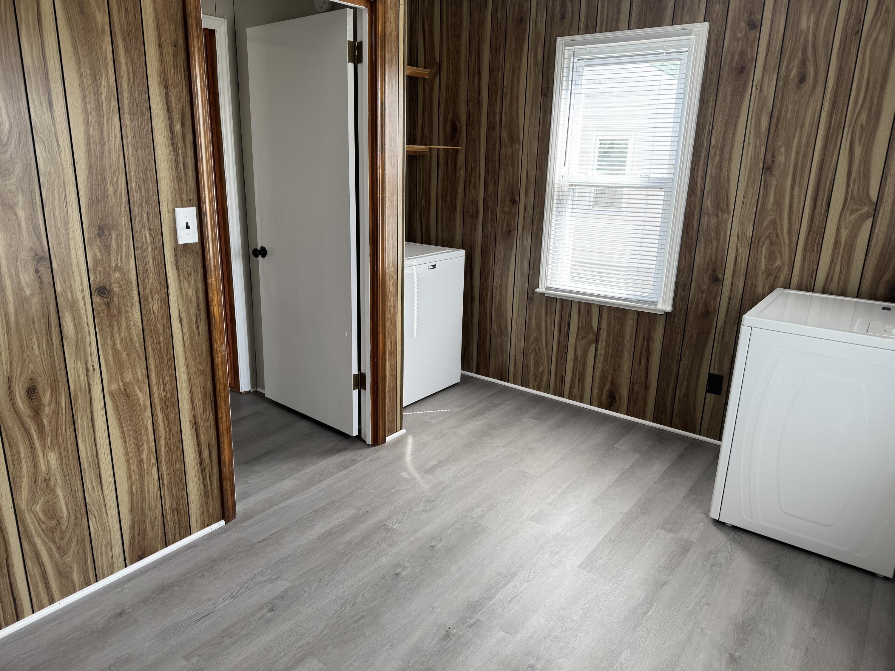 125 Elam Drive Ridgeway, VA 24148 - Photo 9 of 10 an empty room with wooden floor and windows