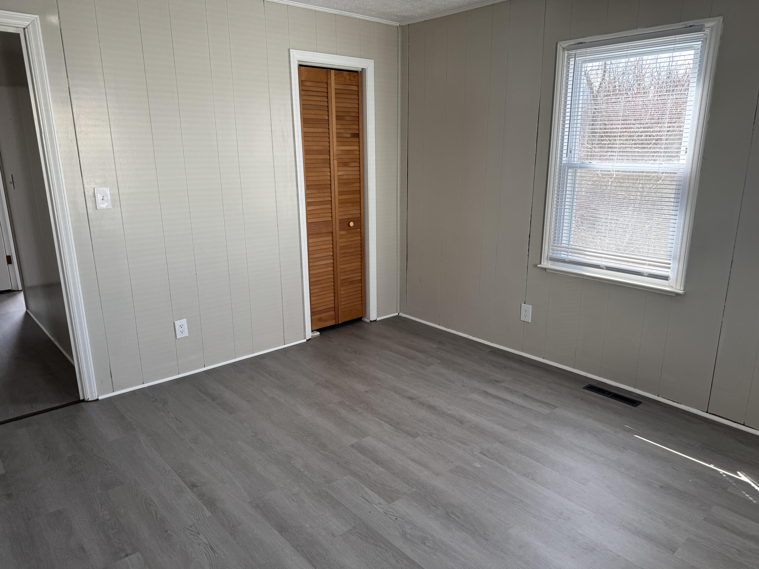 125 Elam Drive Ridgeway, VA 24148 - Photo 10 of 10 an empty room with wooden floor and windows