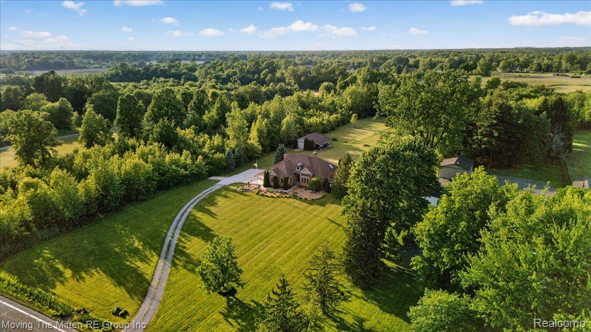 39750 Willow Road New Boston, MI 48164 - Photo 52 of 68 Expansive grounds featuring a meandering driveway, mature trees, manicured lawns, and a private residence