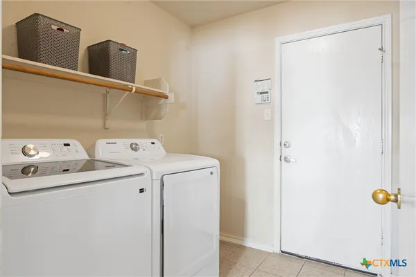 a utility room with dryer and washer