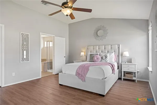 a bedroom with a bed and window