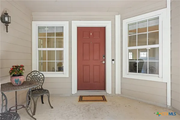 a dining room with furniture and windows