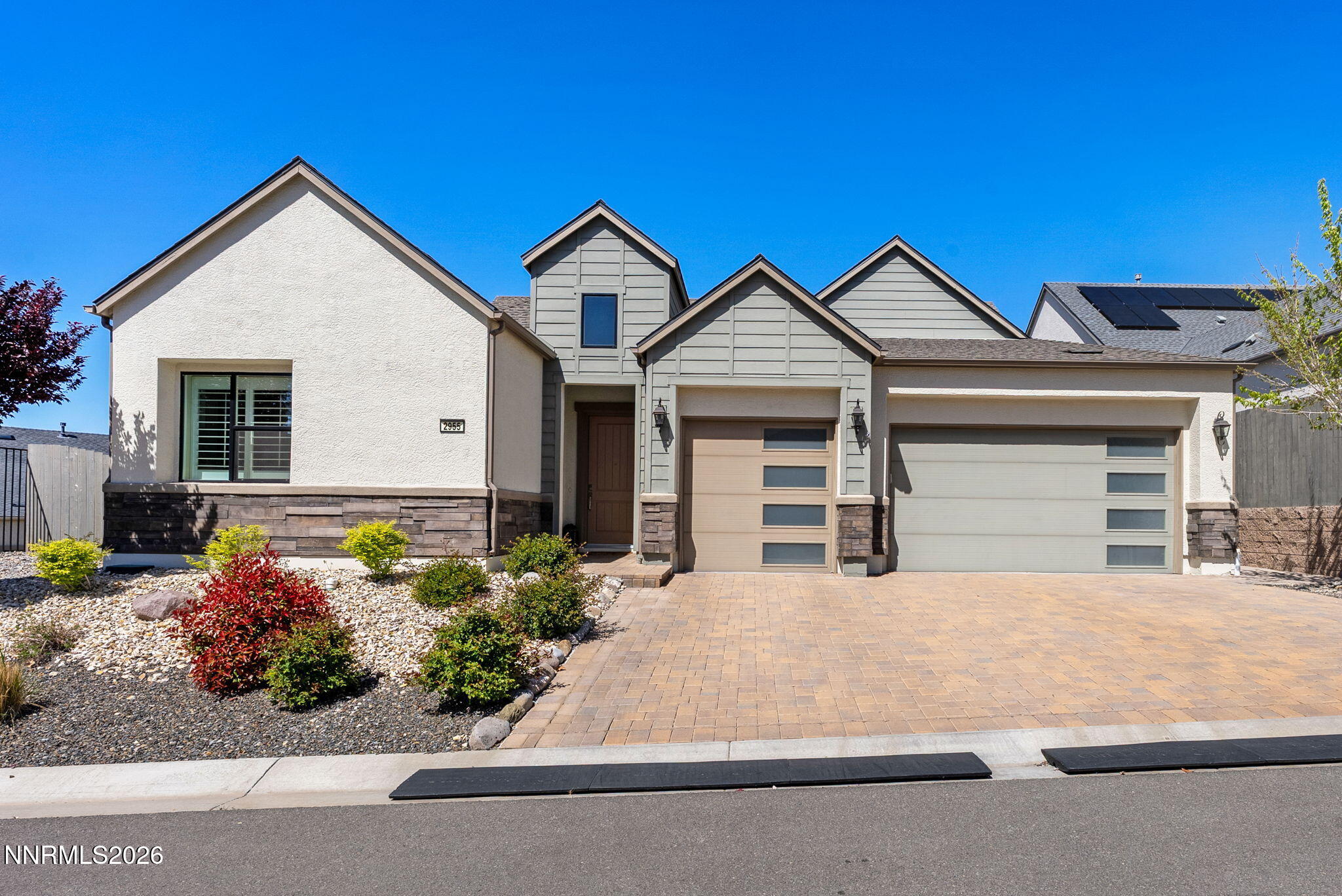 2955 Saddle Peak Drive Reno, NV 89521 - Photo 1 of 38 a front view of a house with a yard and garage