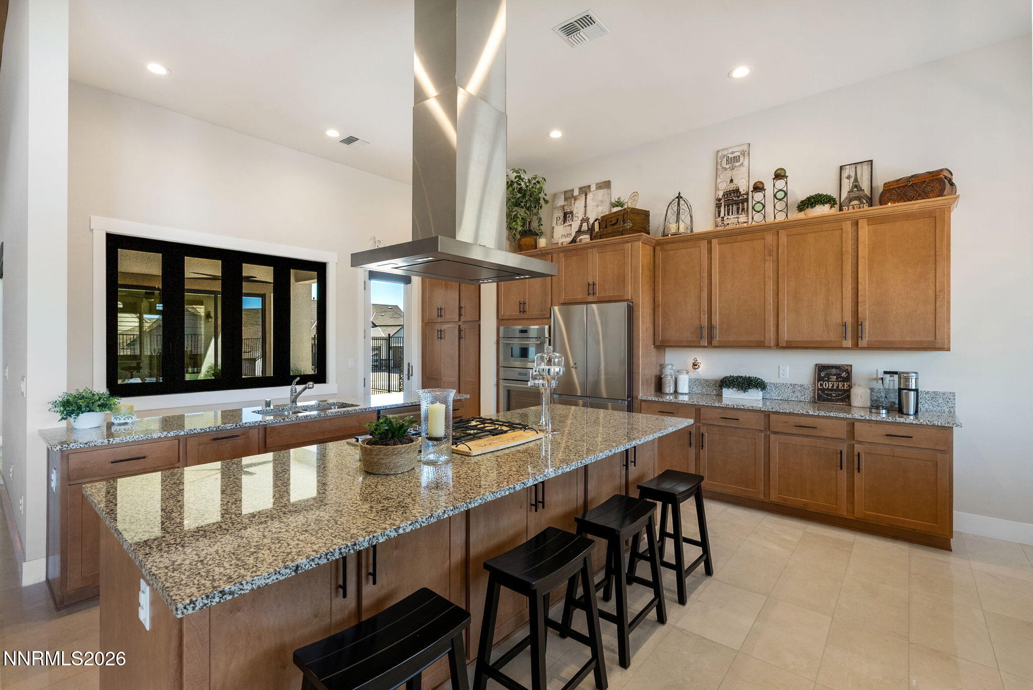 2955 Saddle Peak Drive Reno, NV 89521 - Photo 11 of 38 a large dining hall with stainless steel appliances granite countertop a stove and a sink