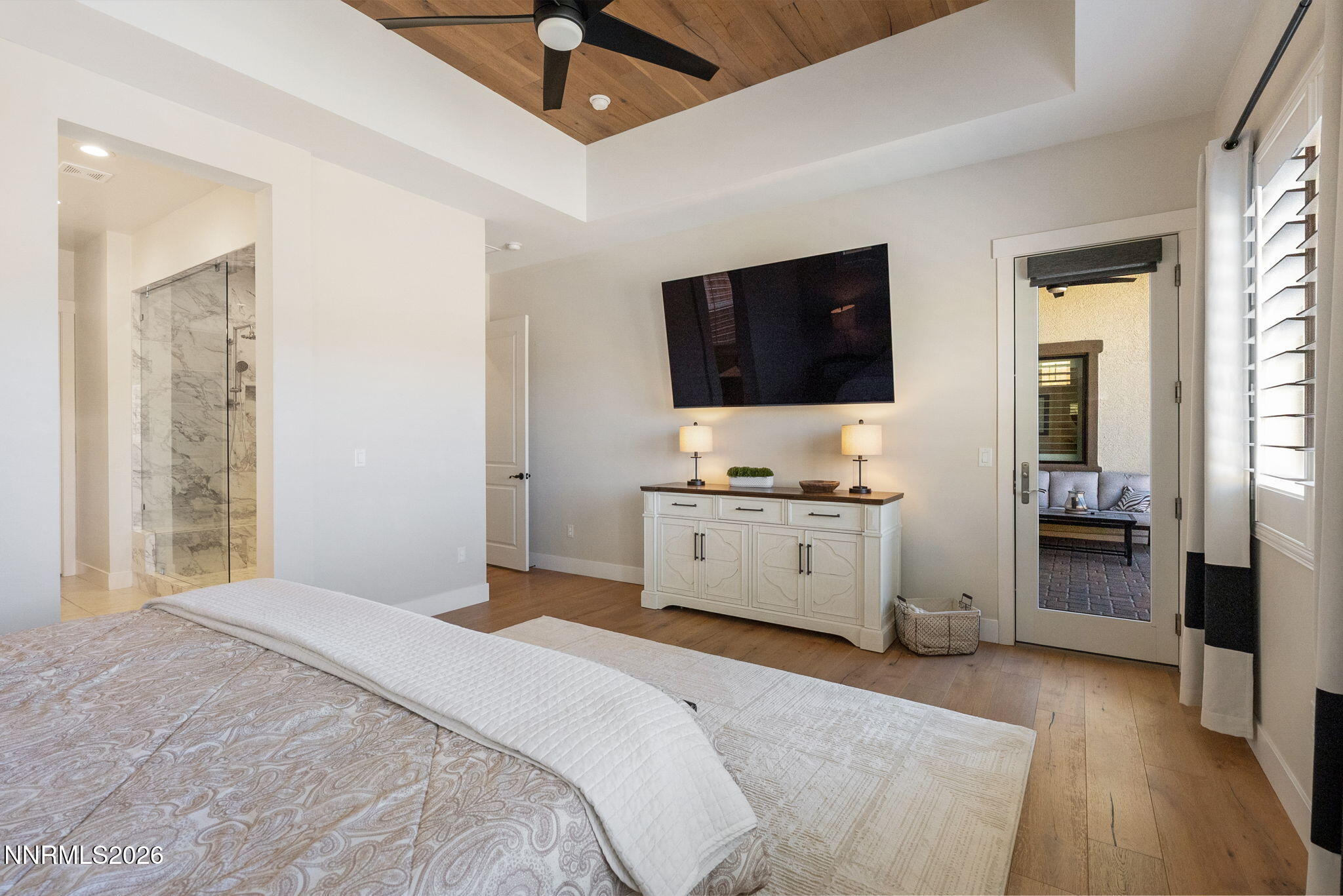 2955 Saddle Peak Drive Reno, NV 89521 - Photo 16 of 38 a bedroom with a bed and a flat screen tv