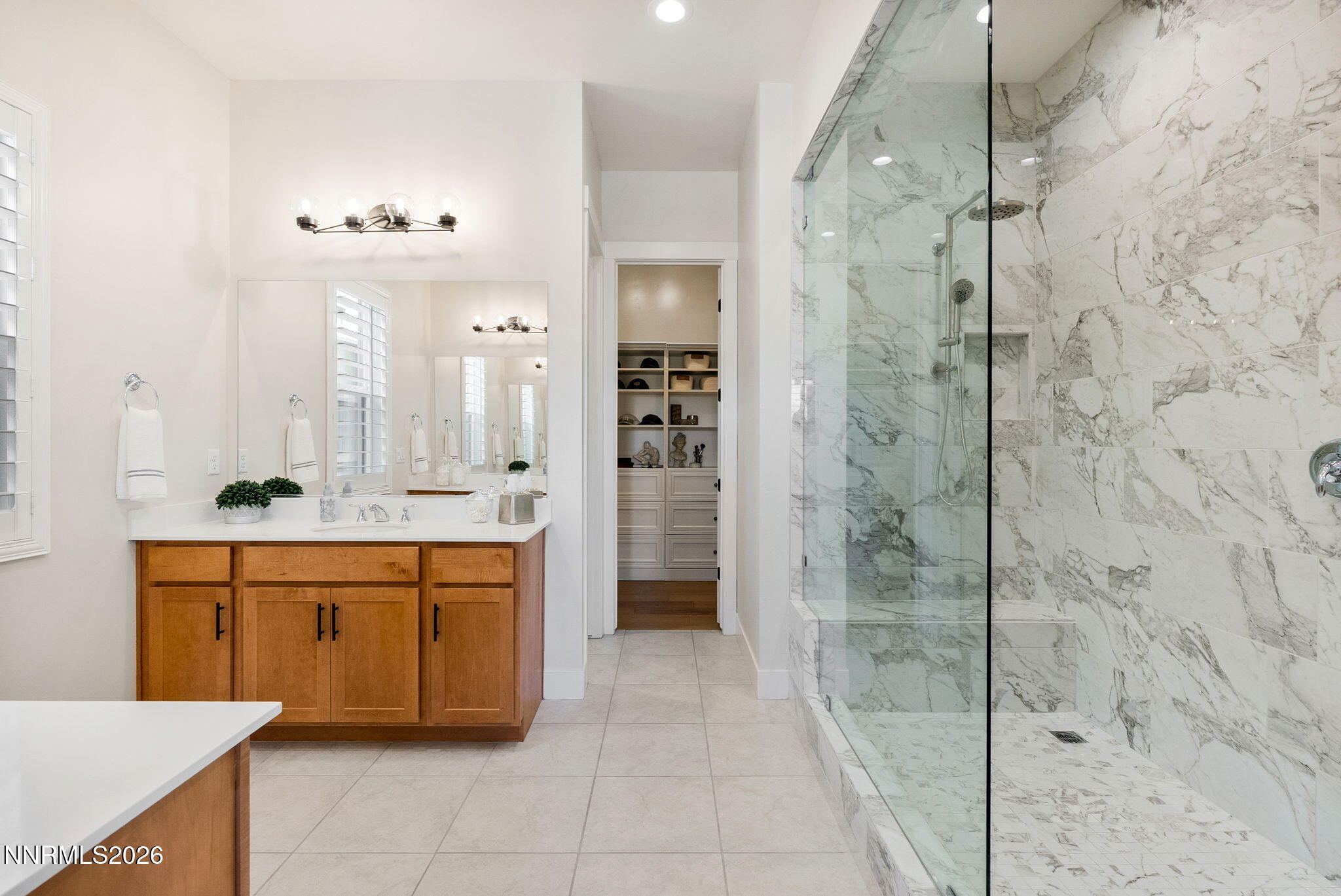 2955 Saddle Peak Drive Reno, NV 89521 - Photo 17 of 38 a bathroom with a double vanity sink mirror and shower
