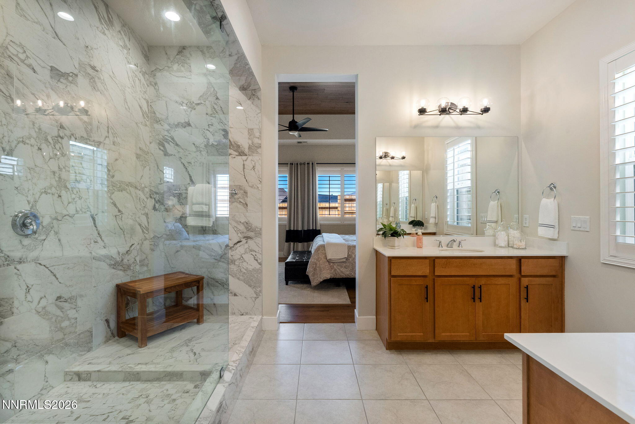 2955 Saddle Peak Drive Reno, NV 89521 - Photo 18 of 38 a spacious bathroom with a shower a sink and a mirror