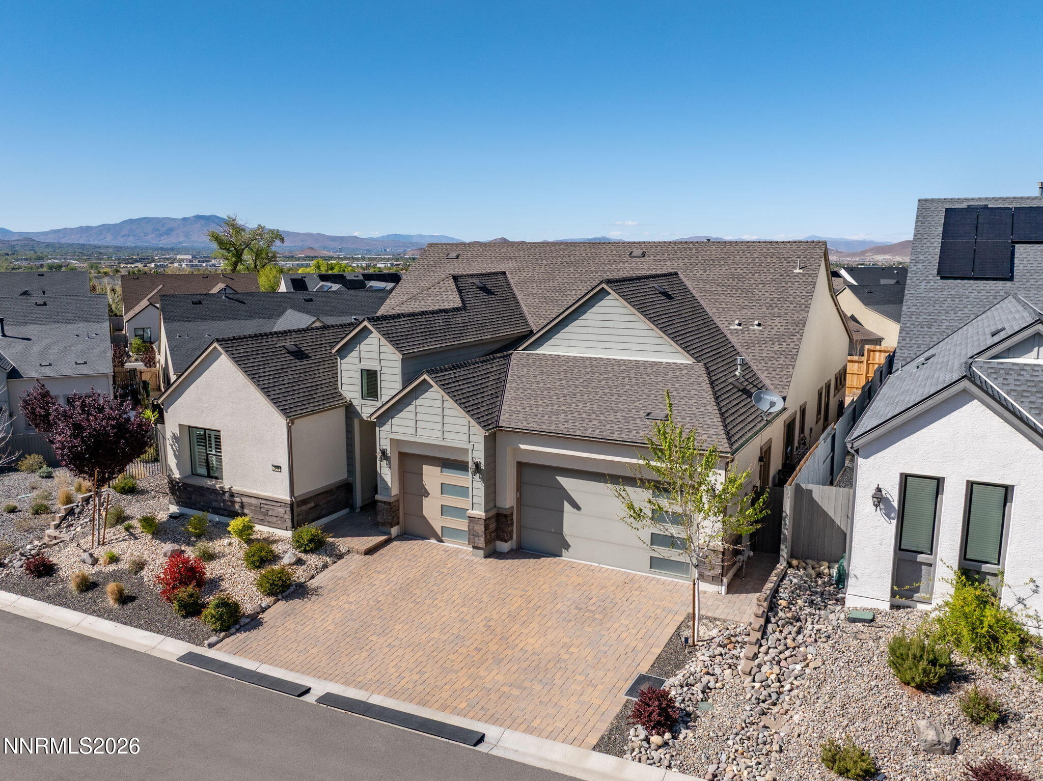 2955 Saddle Peak Drive Reno, NV 89521 - Photo 2 of 38 a front view of a house with a garden