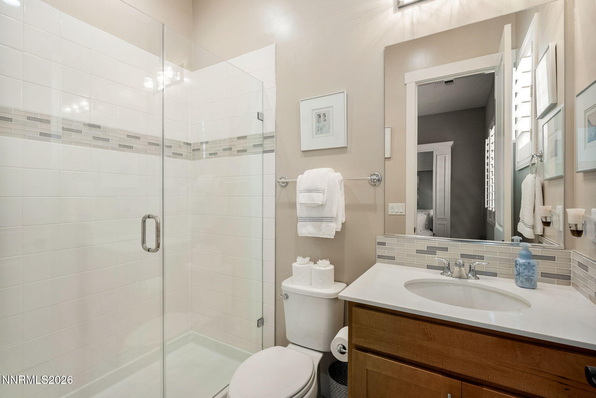 2955 Saddle Peak Drive Reno, NV 89521 - Photo 22 of 38 a bathroom with a sink toilet vanity and shower