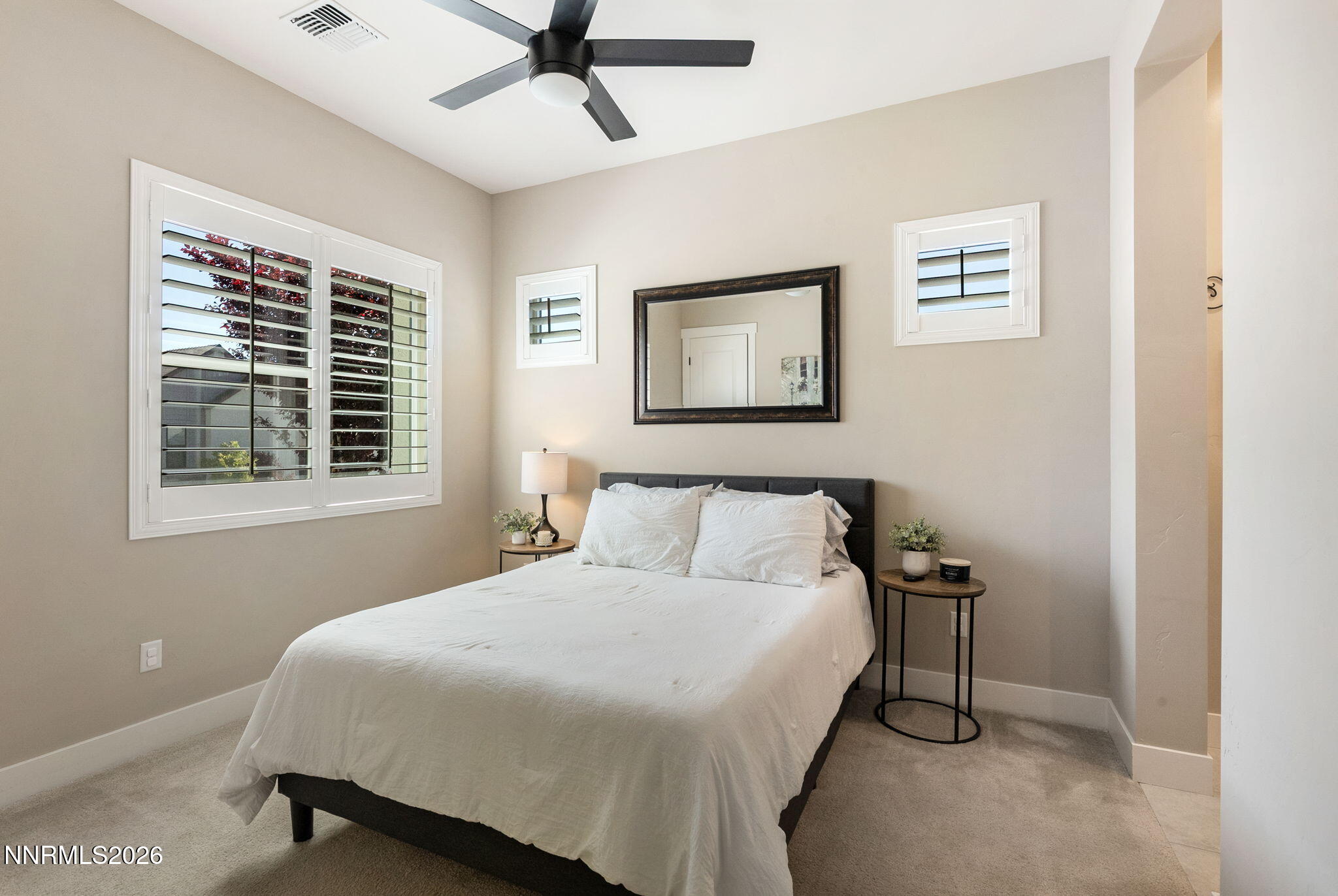 2955 Saddle Peak Drive Reno, NV 89521 - Photo 23 of 38 a bedroom with a bed and a window