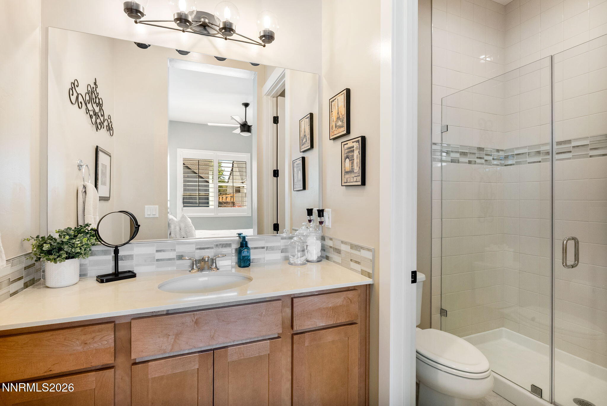 2955 Saddle Peak Drive Reno, NV 89521 - Photo 24 of 38 a bathroom with a sink a toilet and shower