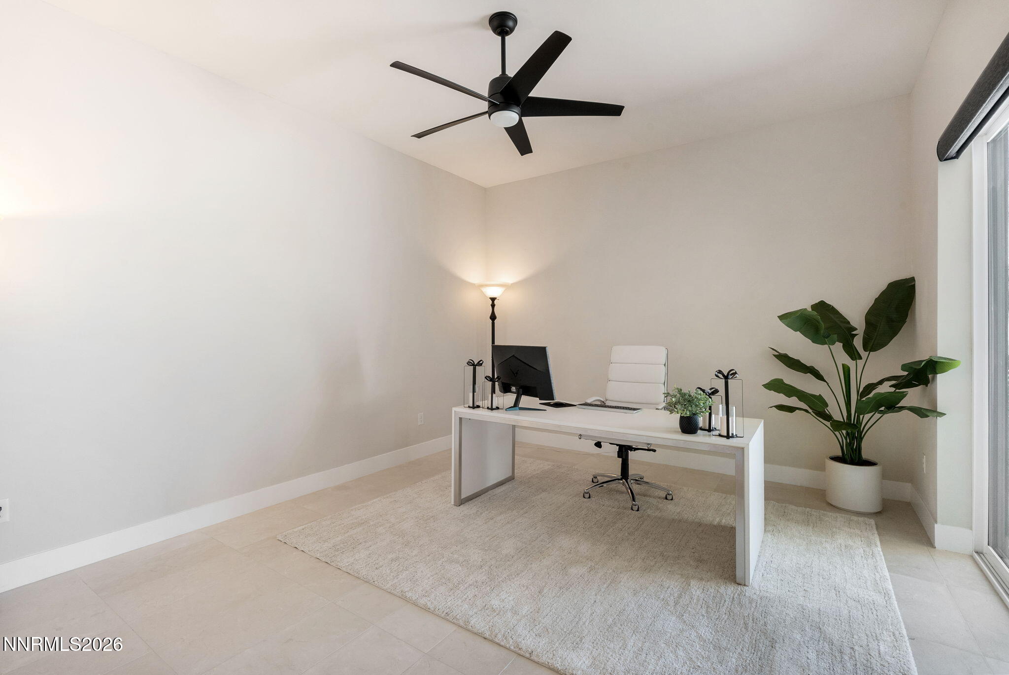2955 Saddle Peak Drive Reno, NV 89521 - Photo 25 of 38 a living room with furniture and a potted plant