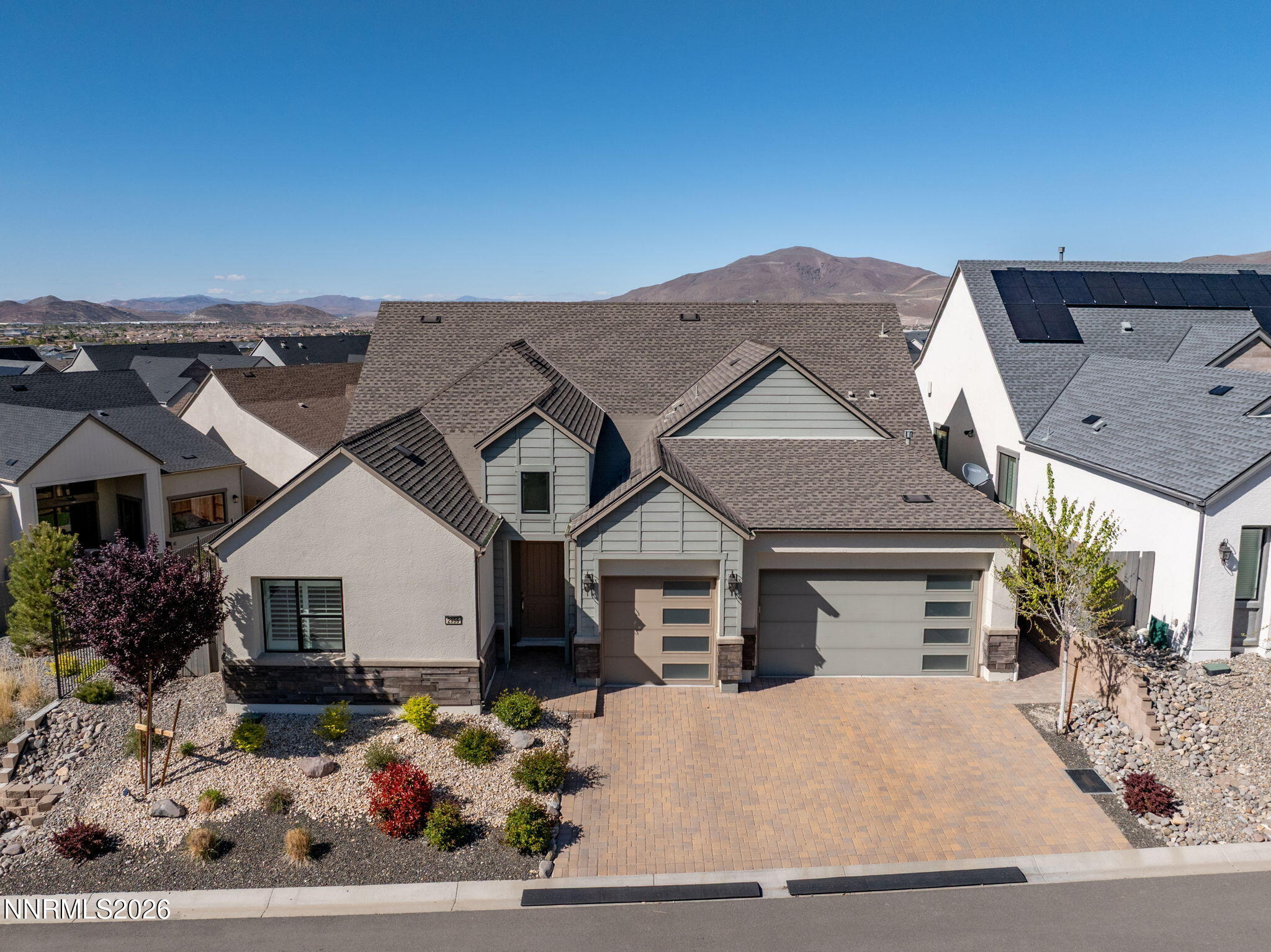 2955 Saddle Peak Drive Reno, NV 89521 - Photo 3 of 38 a front view of a house with a yard and garage