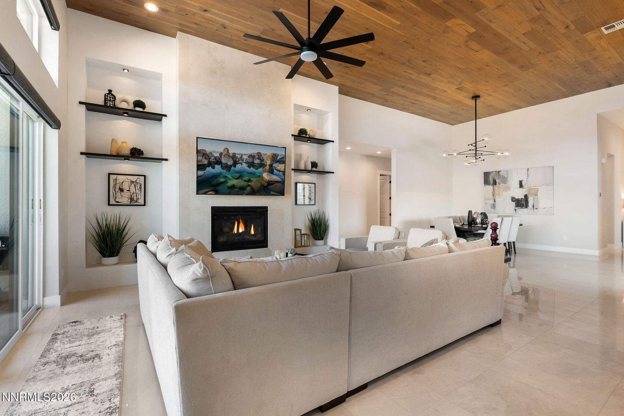 2955 Saddle Peak Drive Reno, NV 89521 - Photo 7 of 38 a living room with furniture a fireplace and a flat screen tv