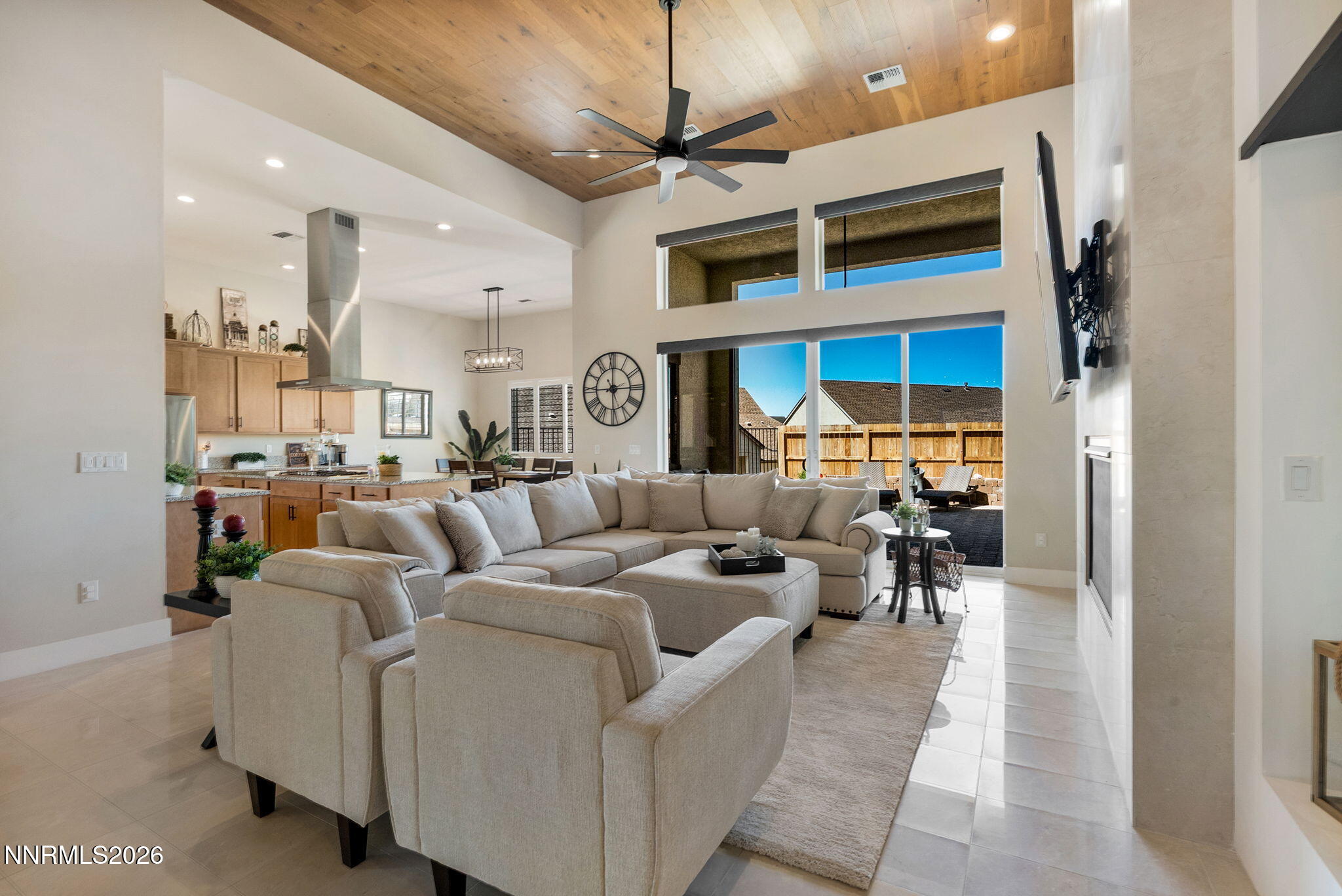 2955 Saddle Peak Drive Reno, NV 89521 - Photo 9 of 38 a living room with furniture a chandelier and a view of kitchen