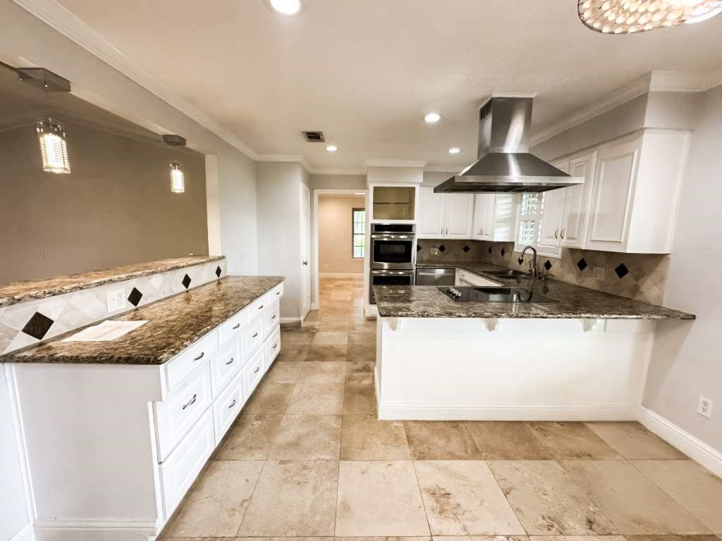 2323 Stevenson Road, Unit CR391 Pearland, TX 77581 - Photo 16 of 46 a large white kitchen with a sink and dishwasher a stove top oven with wooden floor