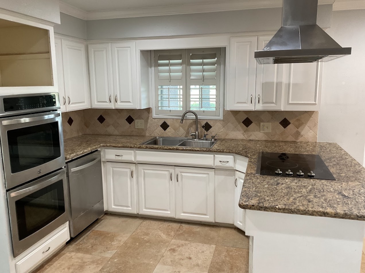 2323 Stevenson Road, Unit CR391 Pearland, TX 77581 - Photo 17 of 46 a kitchen with granite countertop a sink a stove and cabinets