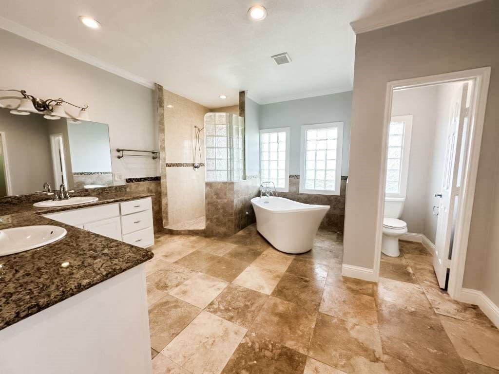 2323 Stevenson Road, Unit CR391 Pearland, TX 77581 - Photo 24 of 46 a spacious bathroom with a granite countertop sink and a mirror