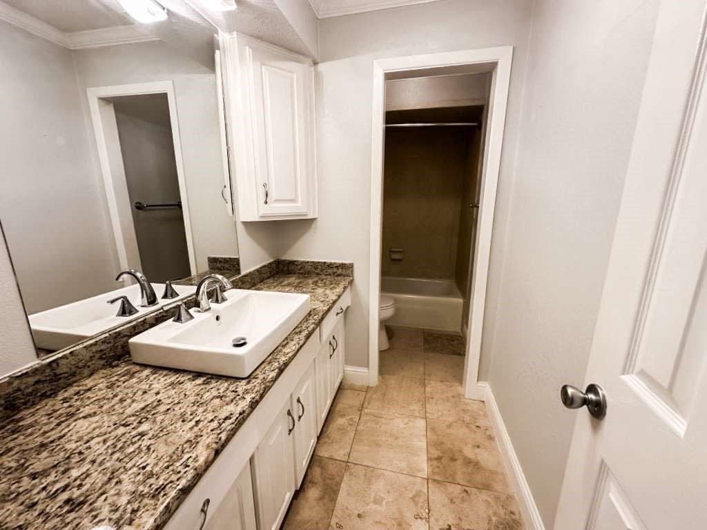 2323 Stevenson Road, Unit CR391 Pearland, TX 77581 - Photo 26 of 46 a bathroom with a sink a toilet and vanity