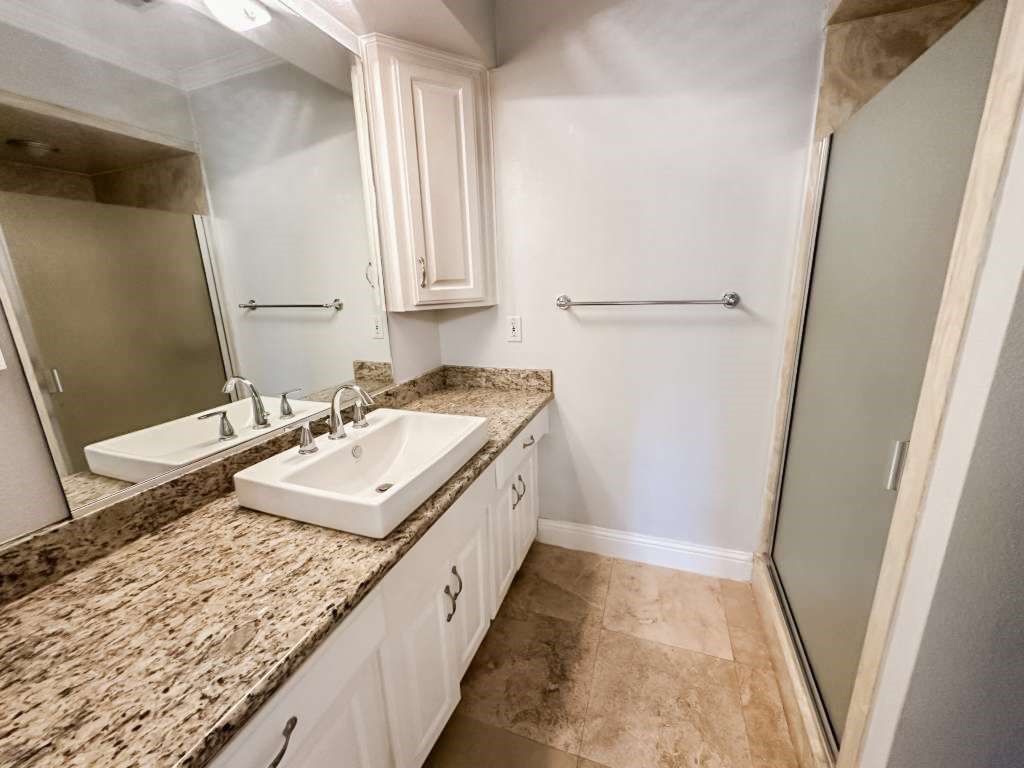 2323 Stevenson Road, Unit CR391 Pearland, TX 77581 - Photo 32 of 46 a bathroom with a sink a vanity and a mirror