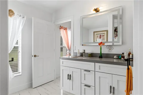 a bathroom with a sink and a mirror