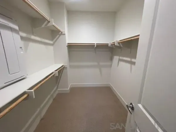 a view of an empty walk in closet