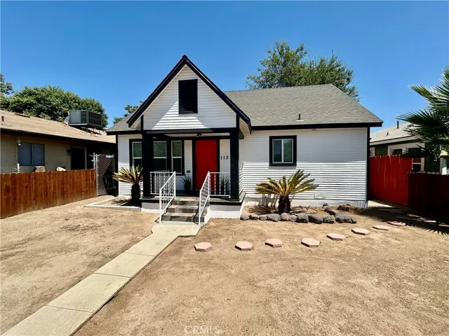 a view of house with yard outdoor seating and entertaining space