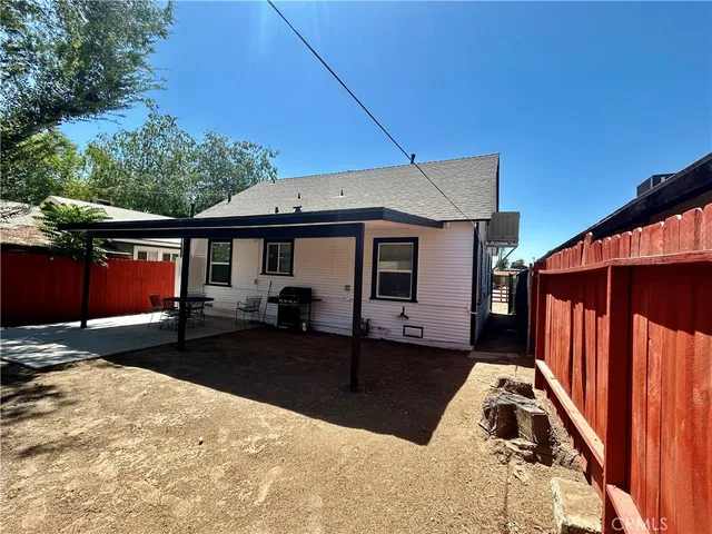 a view of a backyard of the house