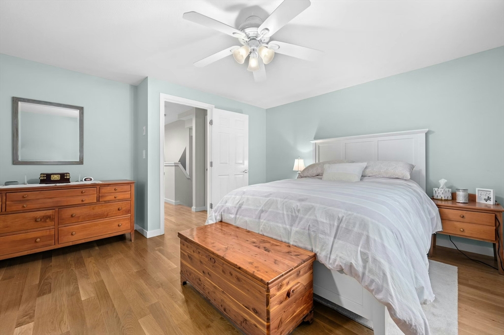 151 Stone Ridge Road, Unit 151 Franklin, MA 02038 - Photo 22 of 39 a bedroom with a bed and a dresser